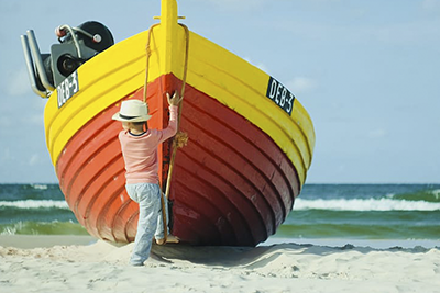 Boy and boat.